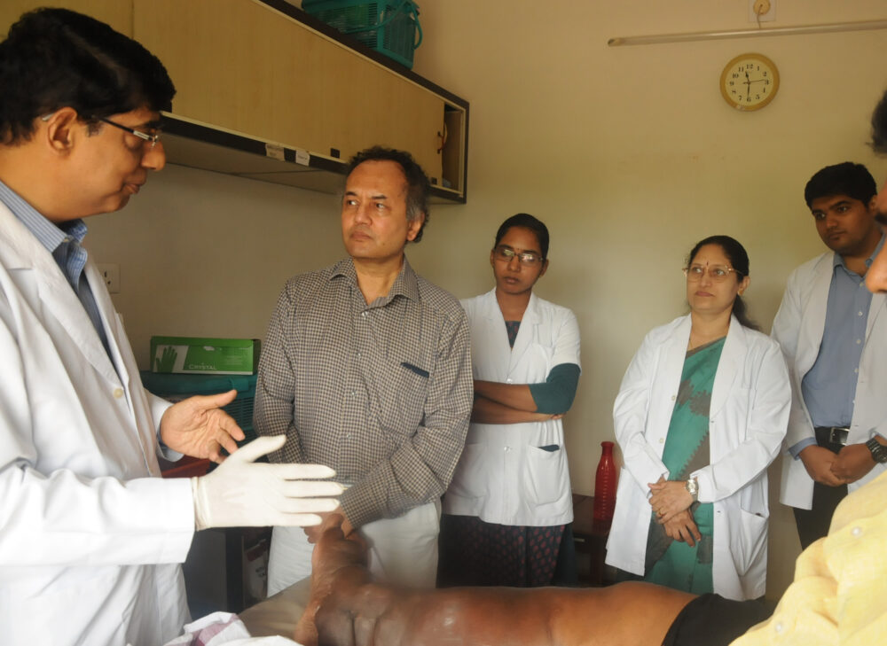 Dr Guruprasad P. Aithal, Professor of Hepatology and the Head of the Division for the Nottingham Digestive Diseases Centre and Deputy Director of Nottingham Molecular Pathology Node at IAD and interacting with the team